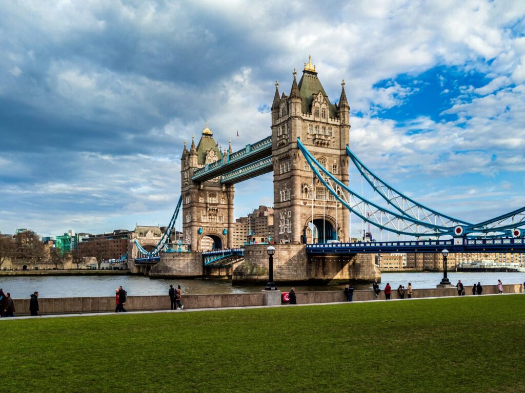 Tower Bridge with Tower of London in background on a clear and sunny day